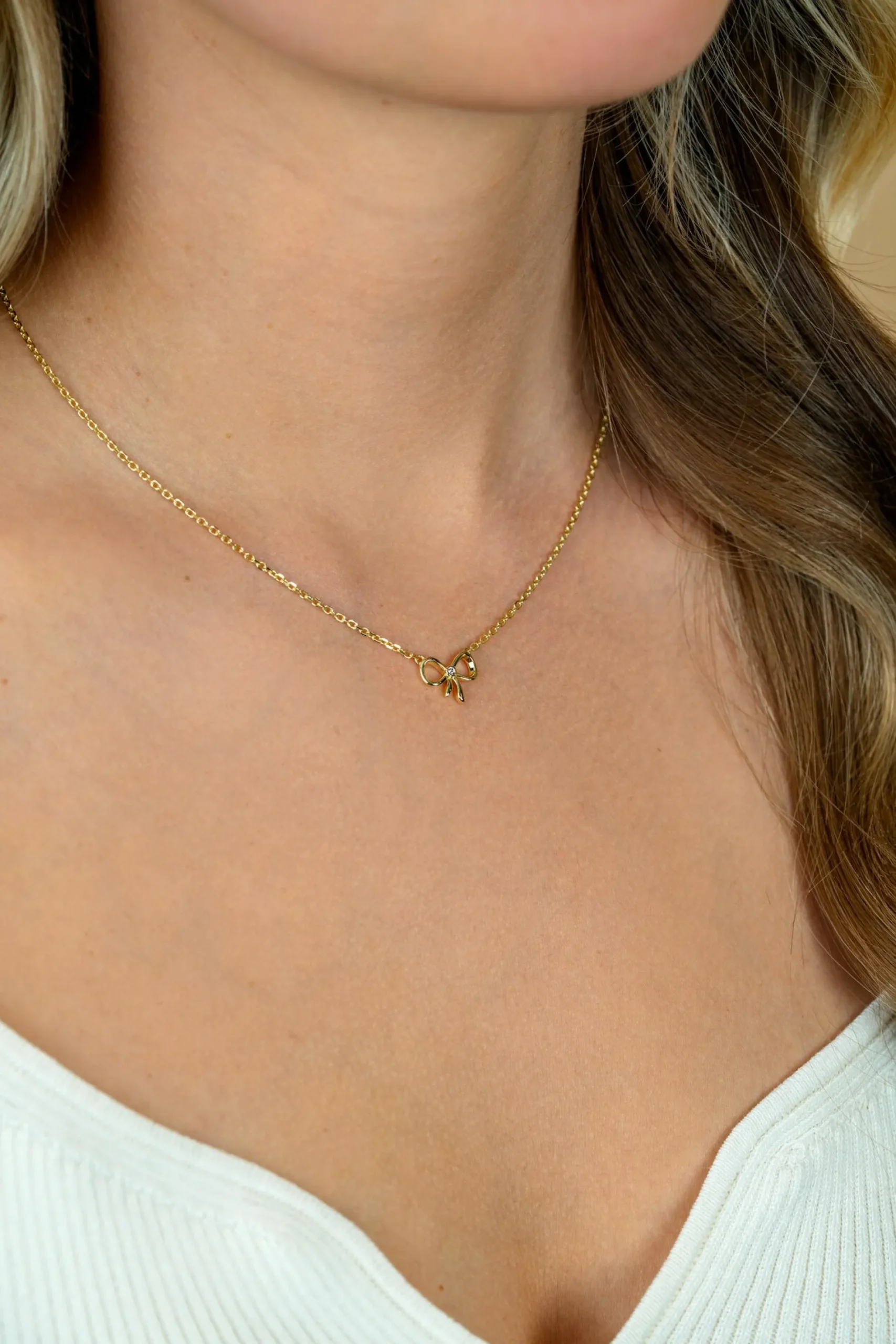 ZINZI gold plated zilveren ketting 42–45cm met sierlijke strik, bezet met witte zirkonia ZIC2724Y