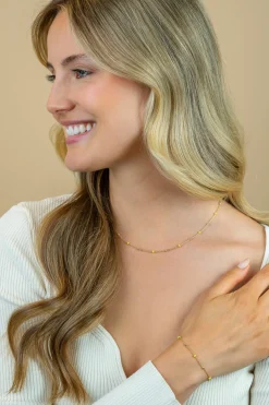 ZINZI gold plated zilveren fantasie ketting met 13 geelgroene donuts en glanzende bolletjes 42-45cm ZIC2508