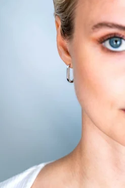 ZINZI zilveren luxe oorringen ovale vorm 20mm zijkant witte zirconia's ZIO2319
